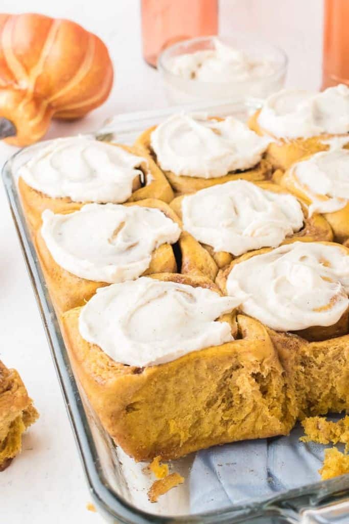 cinnamon pumpkin rolls in tray.