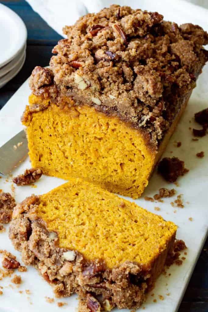 loaf of pumpkin bread with cinnamon pecan streusel.