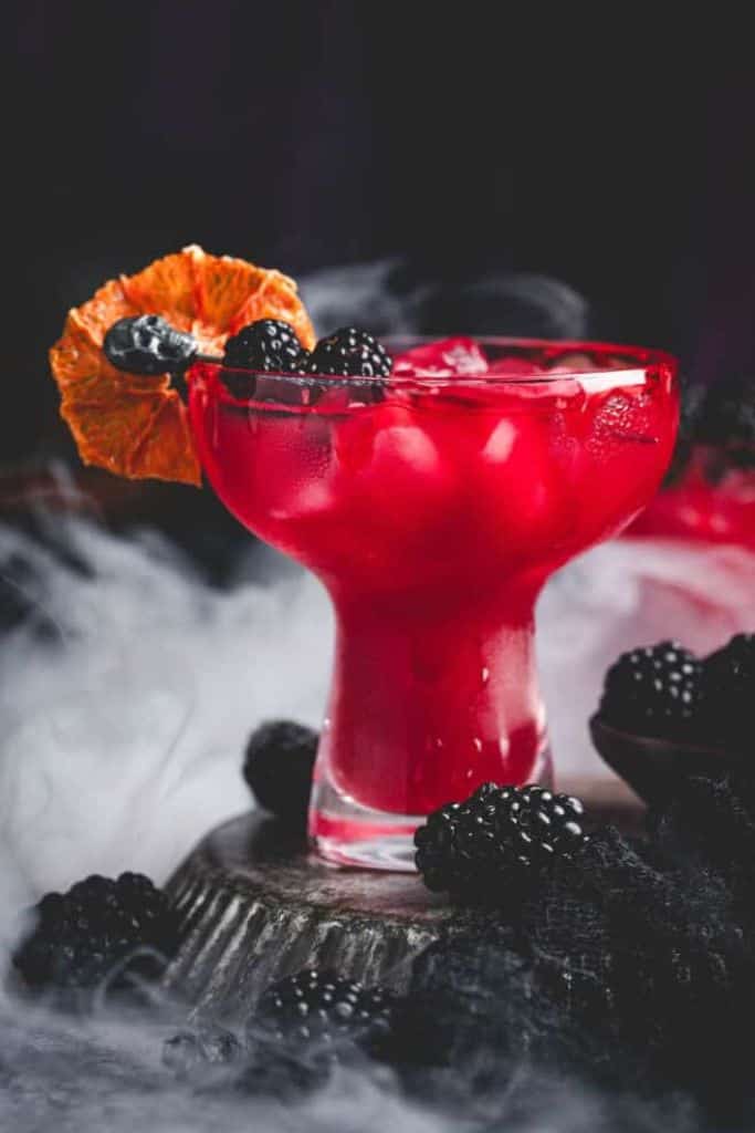 red halloween margarita with blackberries.