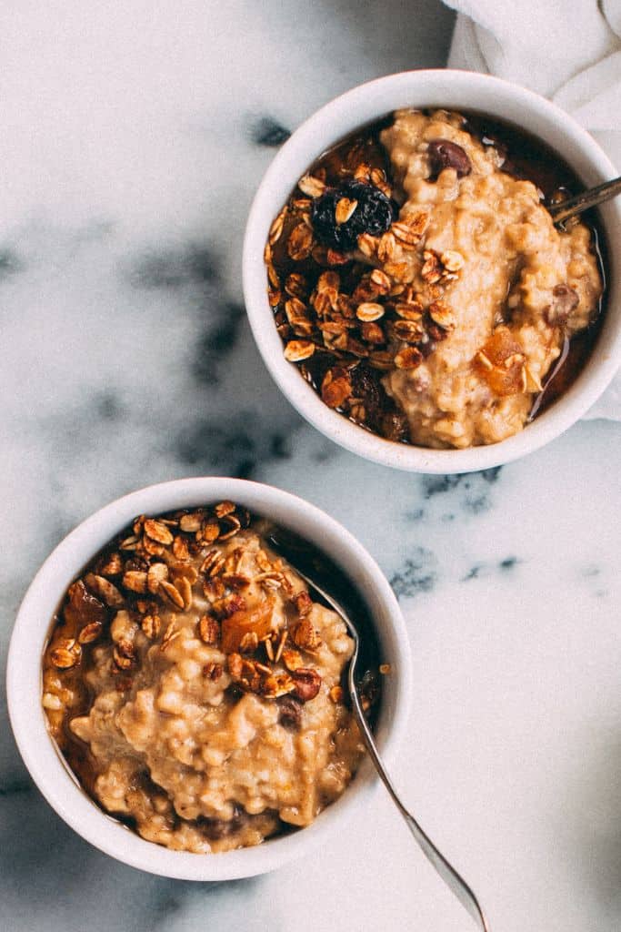 pumpkin oatmeal in bowls with spoons.