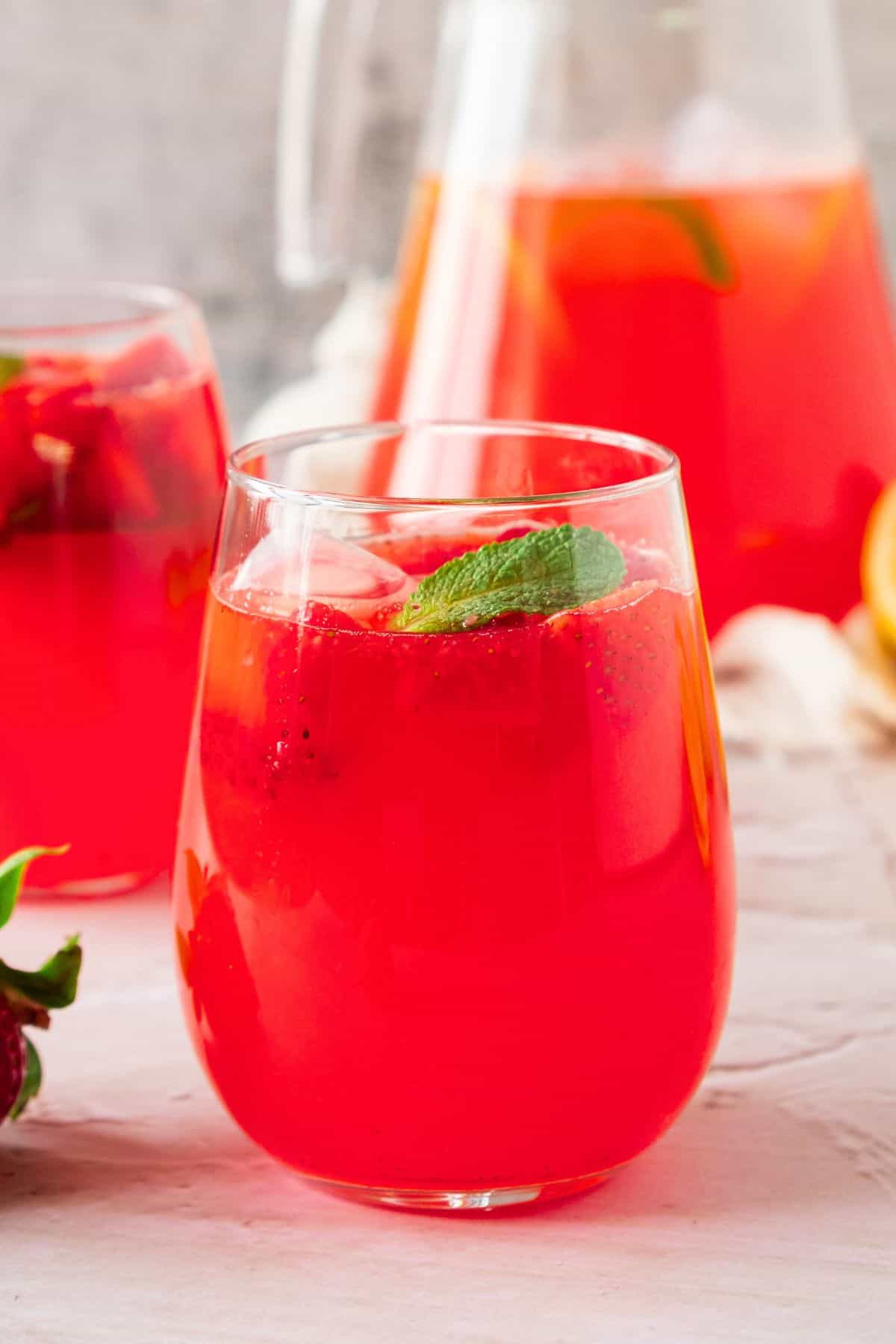 glass with strawberry mint lemonade.