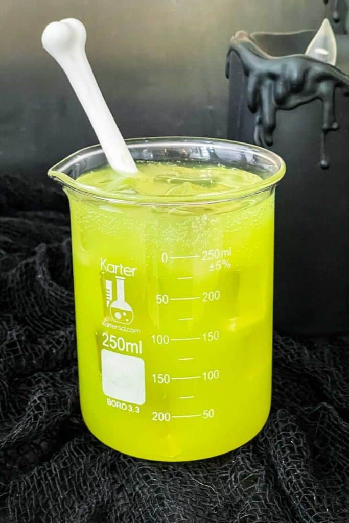 lime green drink in science beaker.