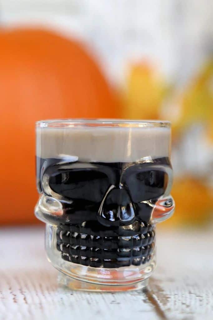 black shot in skull shot glass.