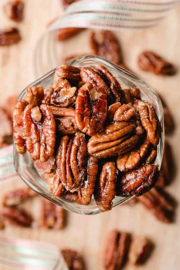 candied pecans in tall glass.