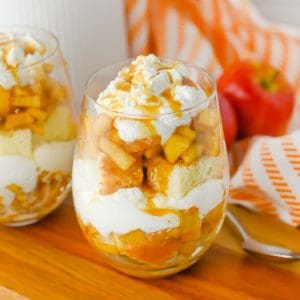 trifle dessert cup with layers of cake and caramel apple.