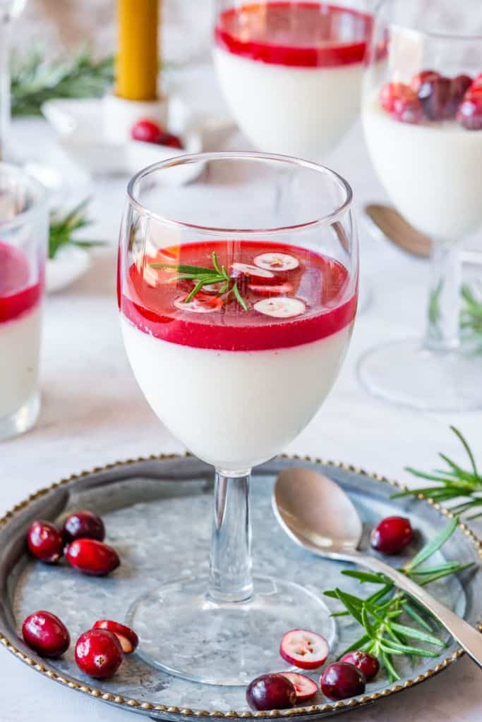 cranberry panna cotta in tall glass.