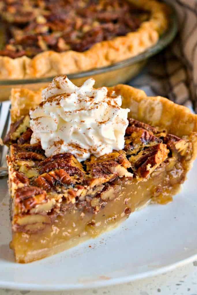 a slice of southern pecan pie on plate.