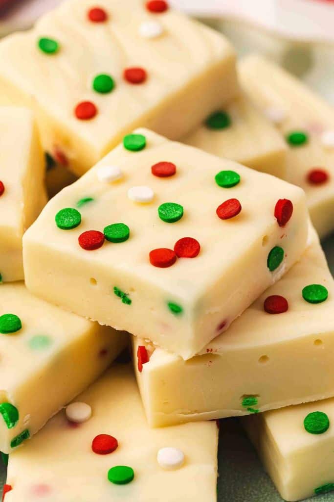 sugar cookie flavored holiday fudge pieces with festive sprinkles.