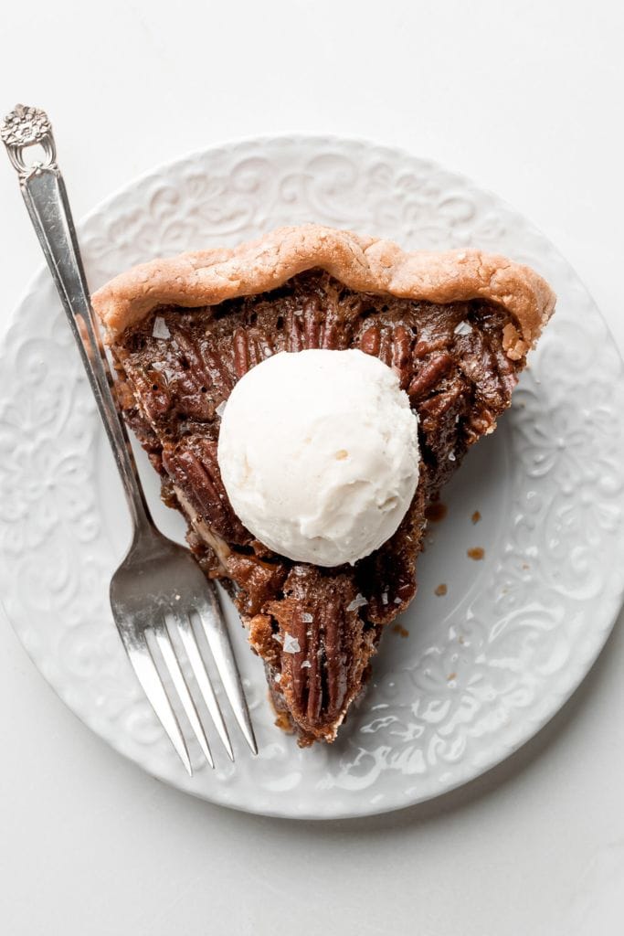 slice of gluten free pecan pie on plate.