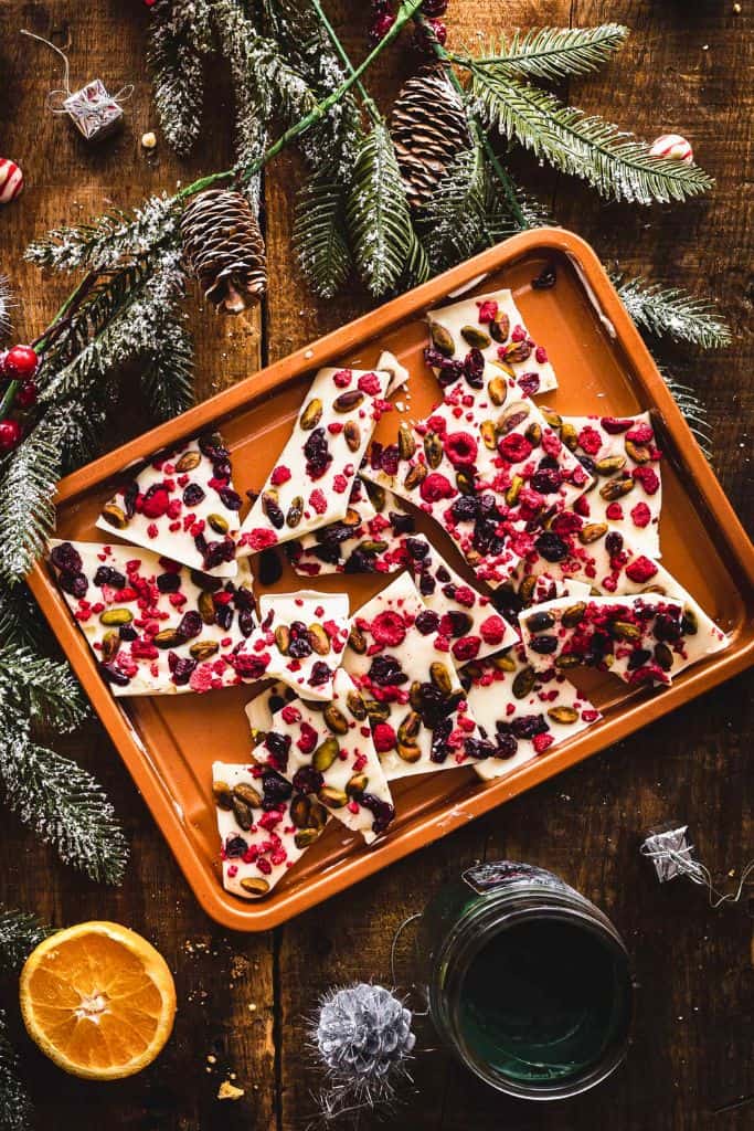 pieces of white chocolate bark with cranberries and pistachios.
