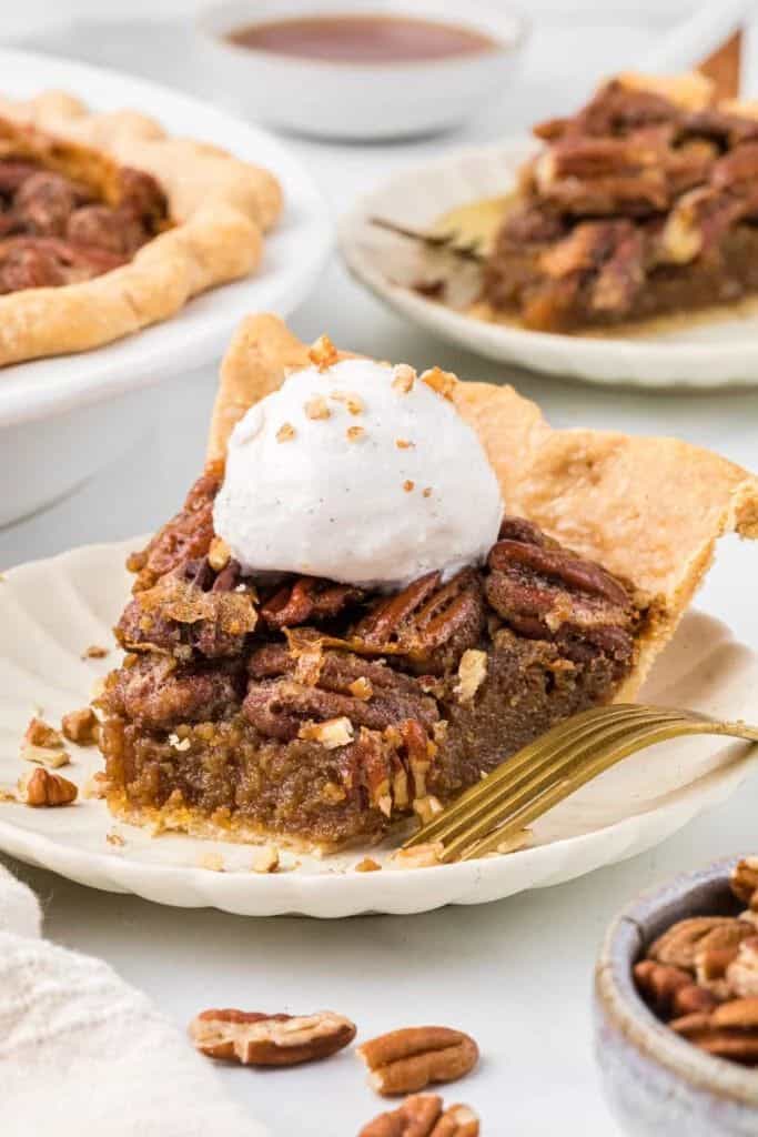 slice of maple pecan pie on plate.