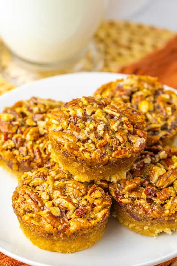 mini pecan pies on plate.