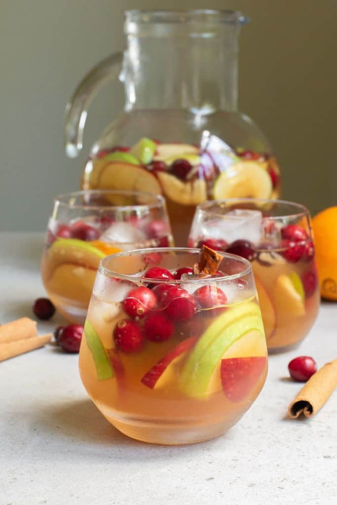 non alcoholic punch in glass and pitcher.