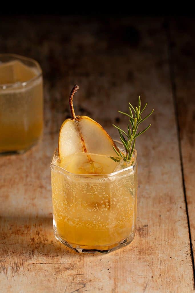 pear and ginger mocktail in glass with pear garnish.
