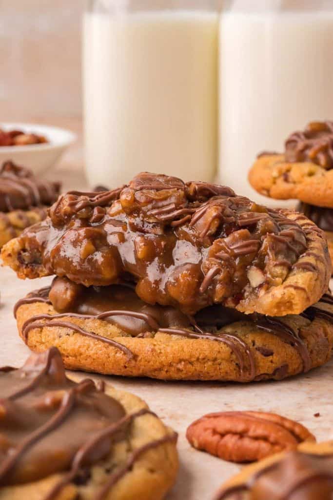 pecan pie cookies covered in chocolate, stacked.