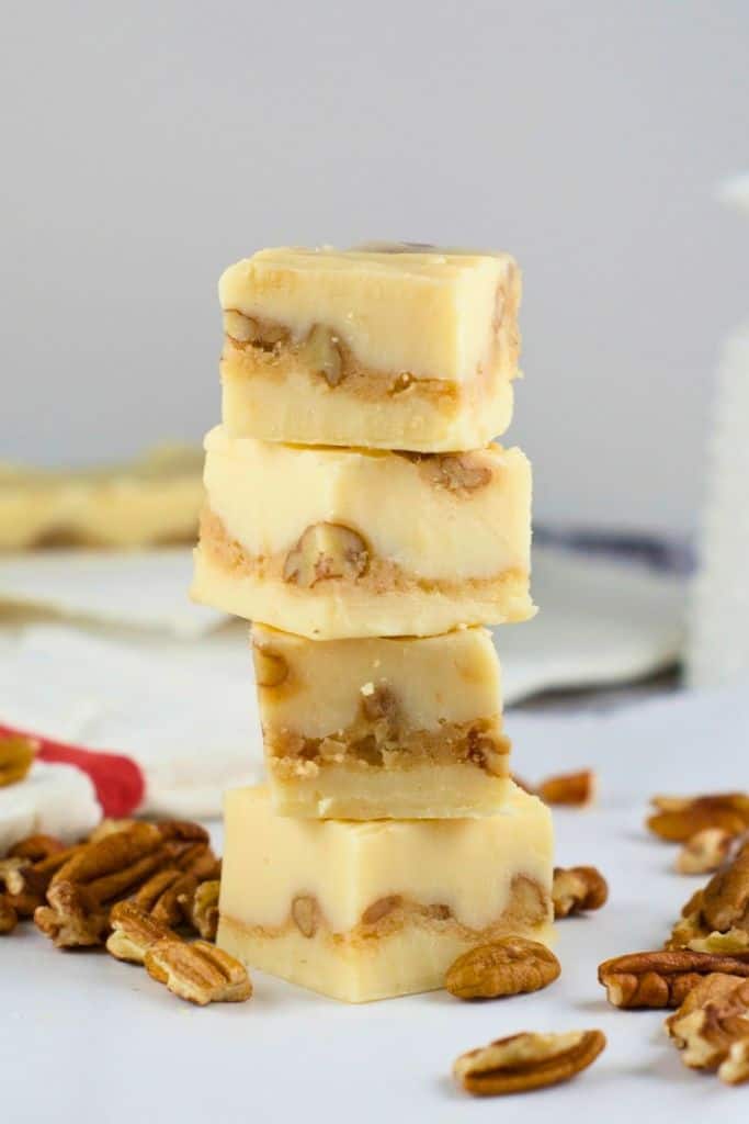 stack of white pecan praline fudge squares.