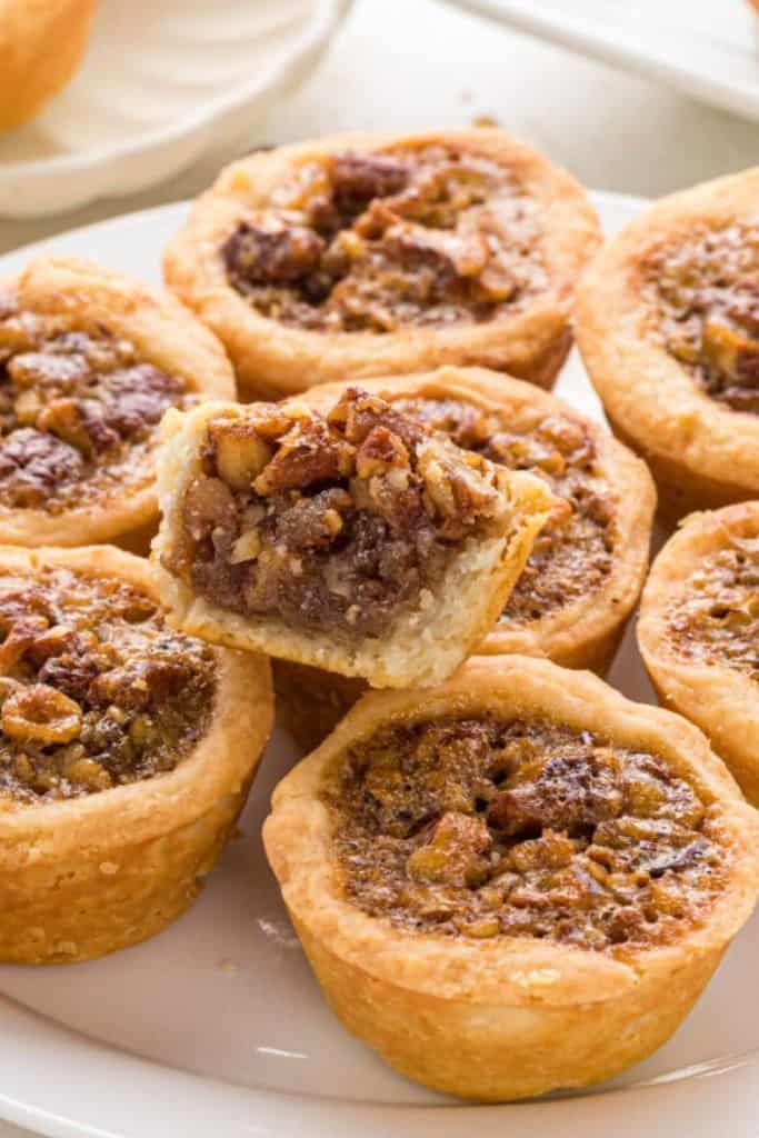 Mini pecan bites with caramelized pecans and a golden crust.