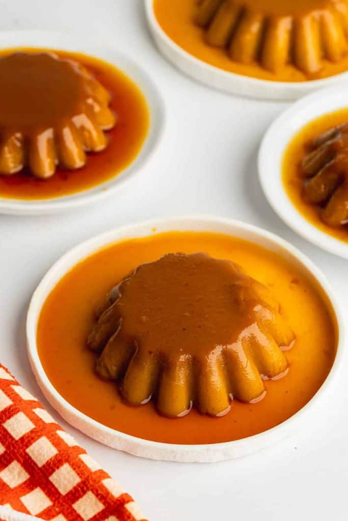 no bake flan with caramel syrup on plate.