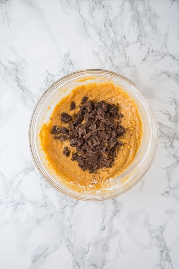 pumpkin mixture with chocolate chunks in bowl.