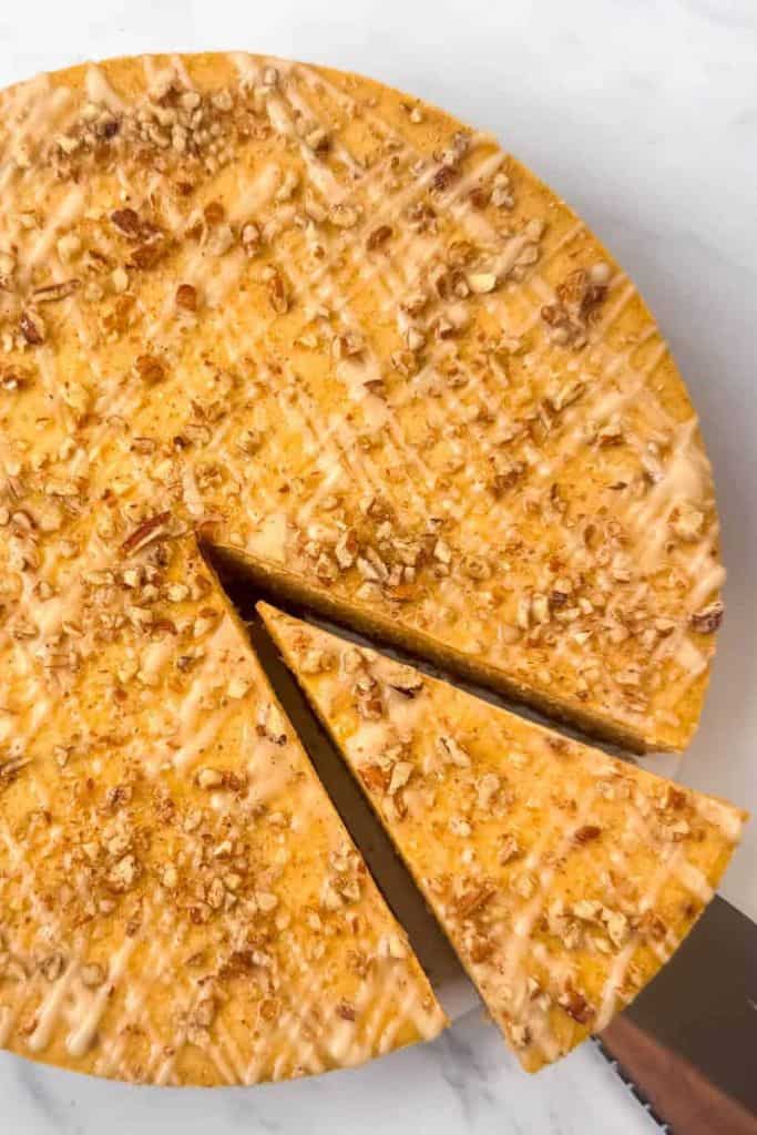 pumpkin pecan cheesecake with slice.