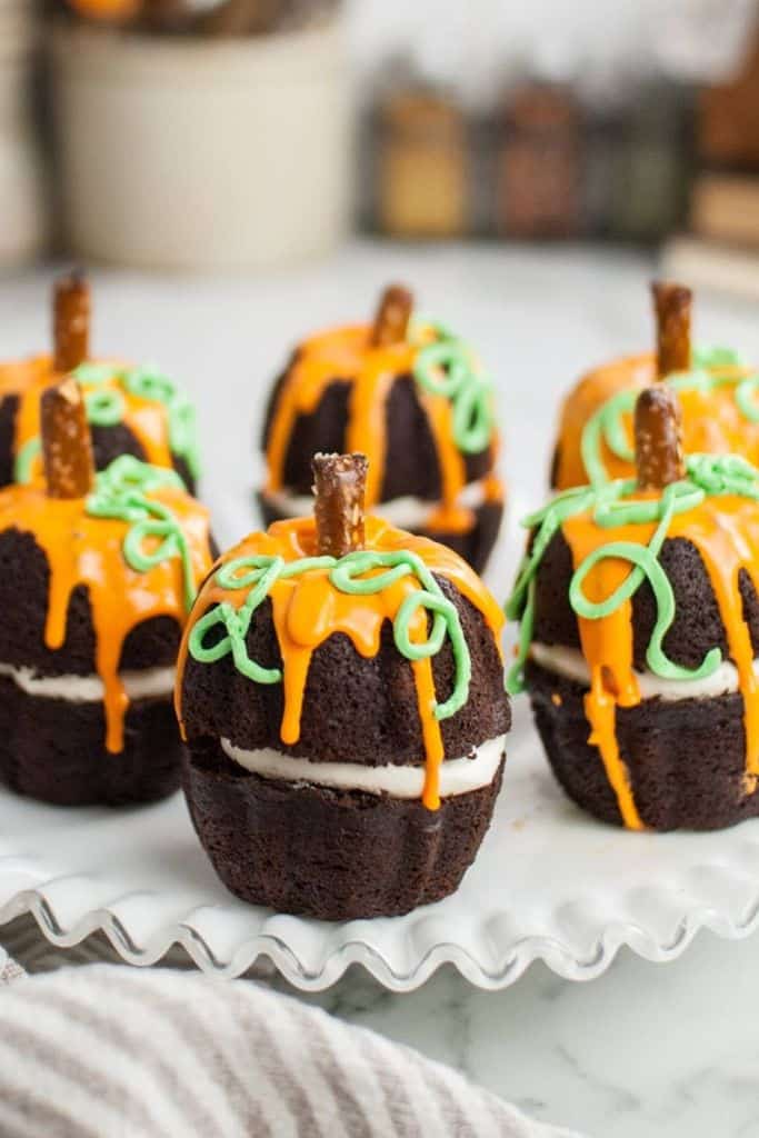 pumpkin shaped bundt cakes decorated.