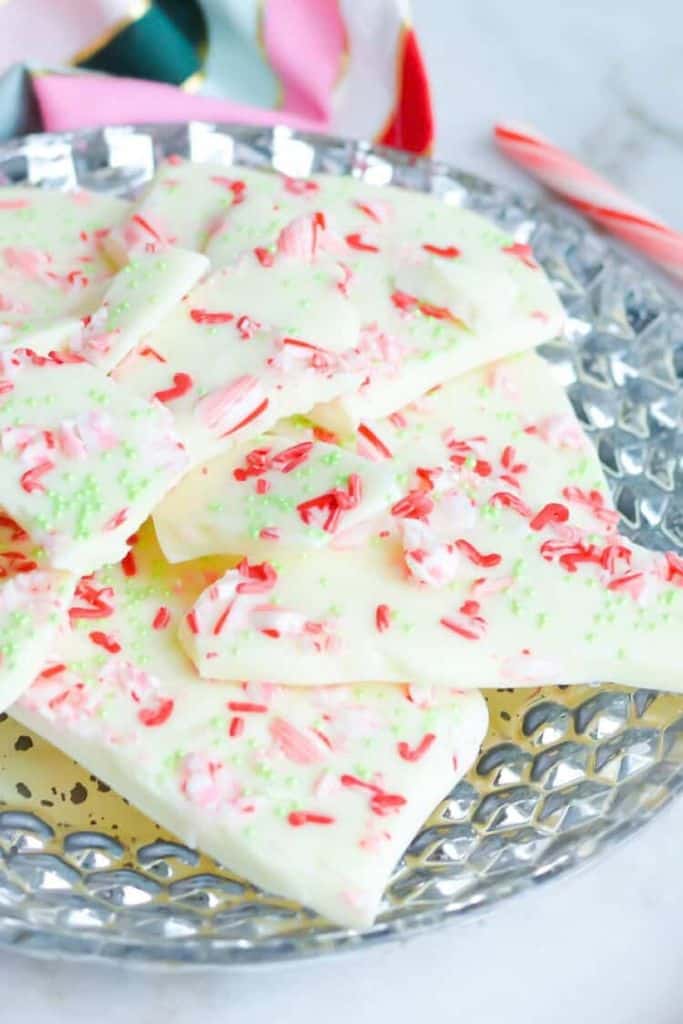 pieces of white chocolate peppermint bark on plate.