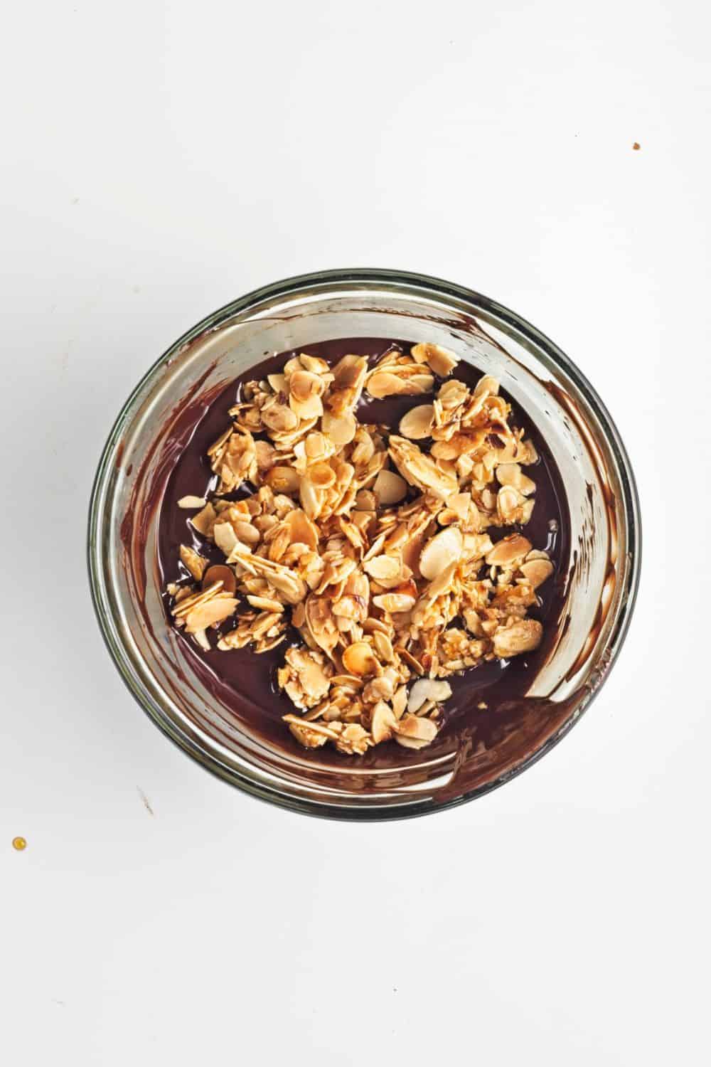 flaked almonds and melted chocolate in bowl.