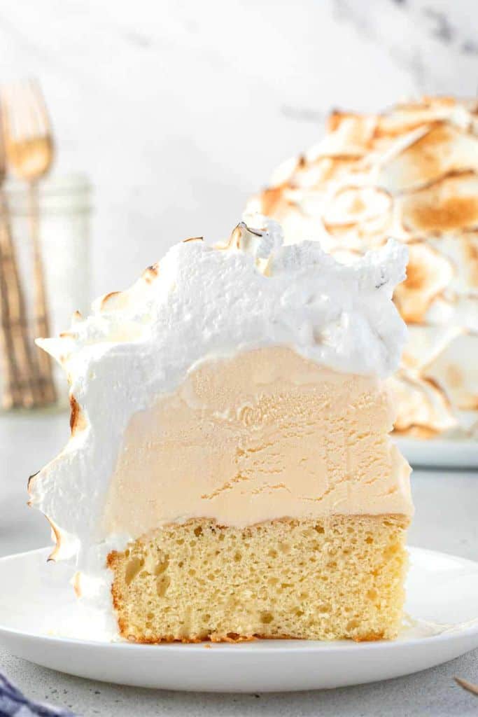 slice of baked alaska dessert on plate.