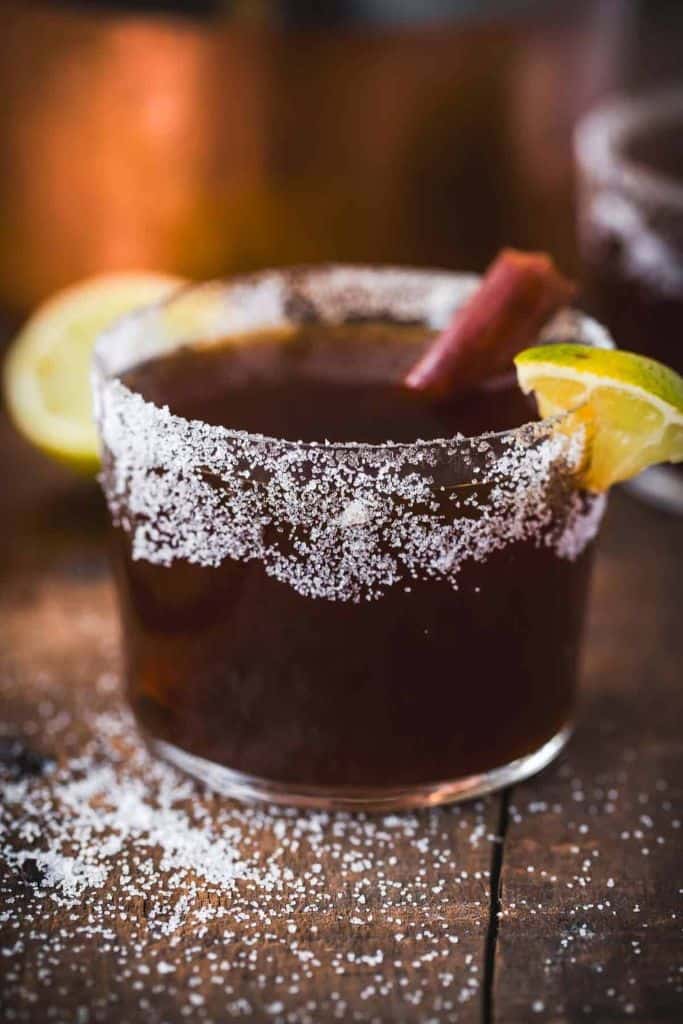 colombian cocktail in short glass with sugar rim.