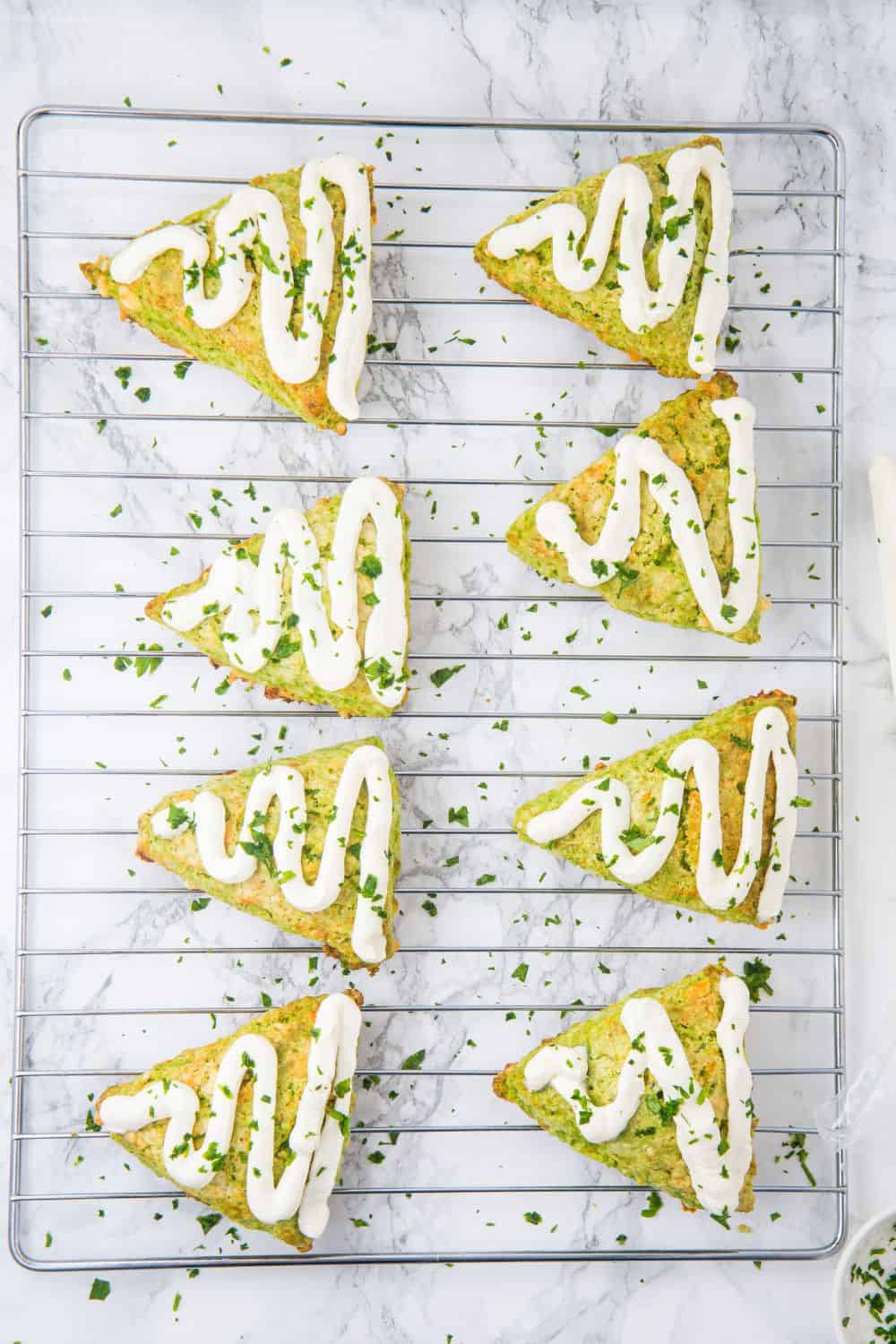 christmas tree shaped scones on wire rack.