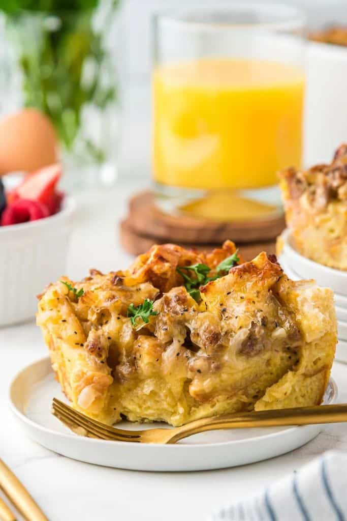 sausage breakfast casserole slice on plate.