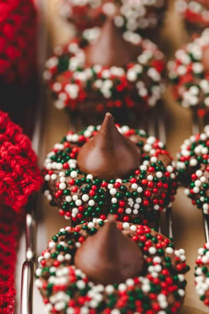 christmas kiss cookies with festive sprinkles.