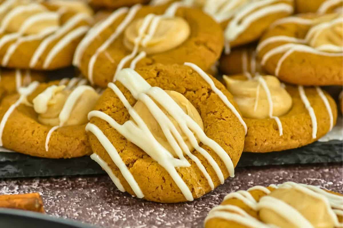 gingerbread thumbprint cookies with white chocolate drizzle.