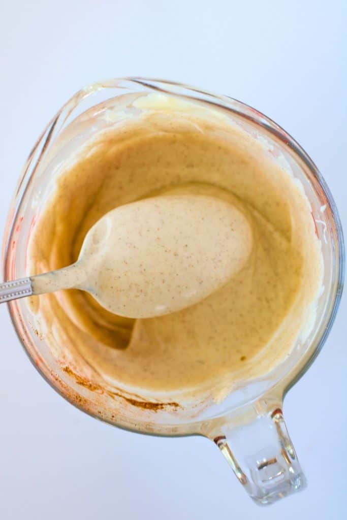melted white chocolate in glass jug.