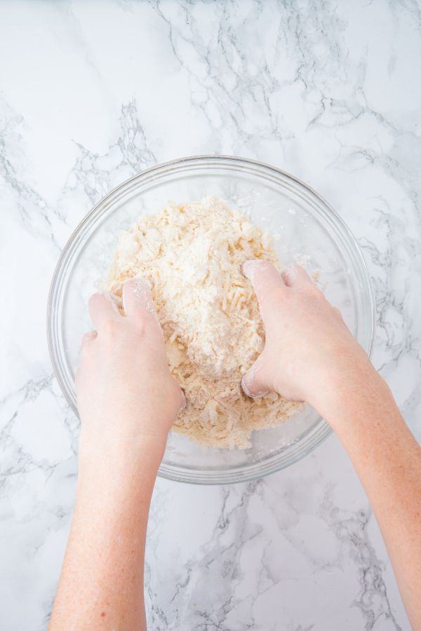 combining scones ingredients in bowl.