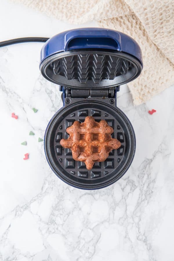 cooked waffle cookie in waffle maker.