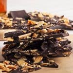 stack of dark chocolate almond bark candy.