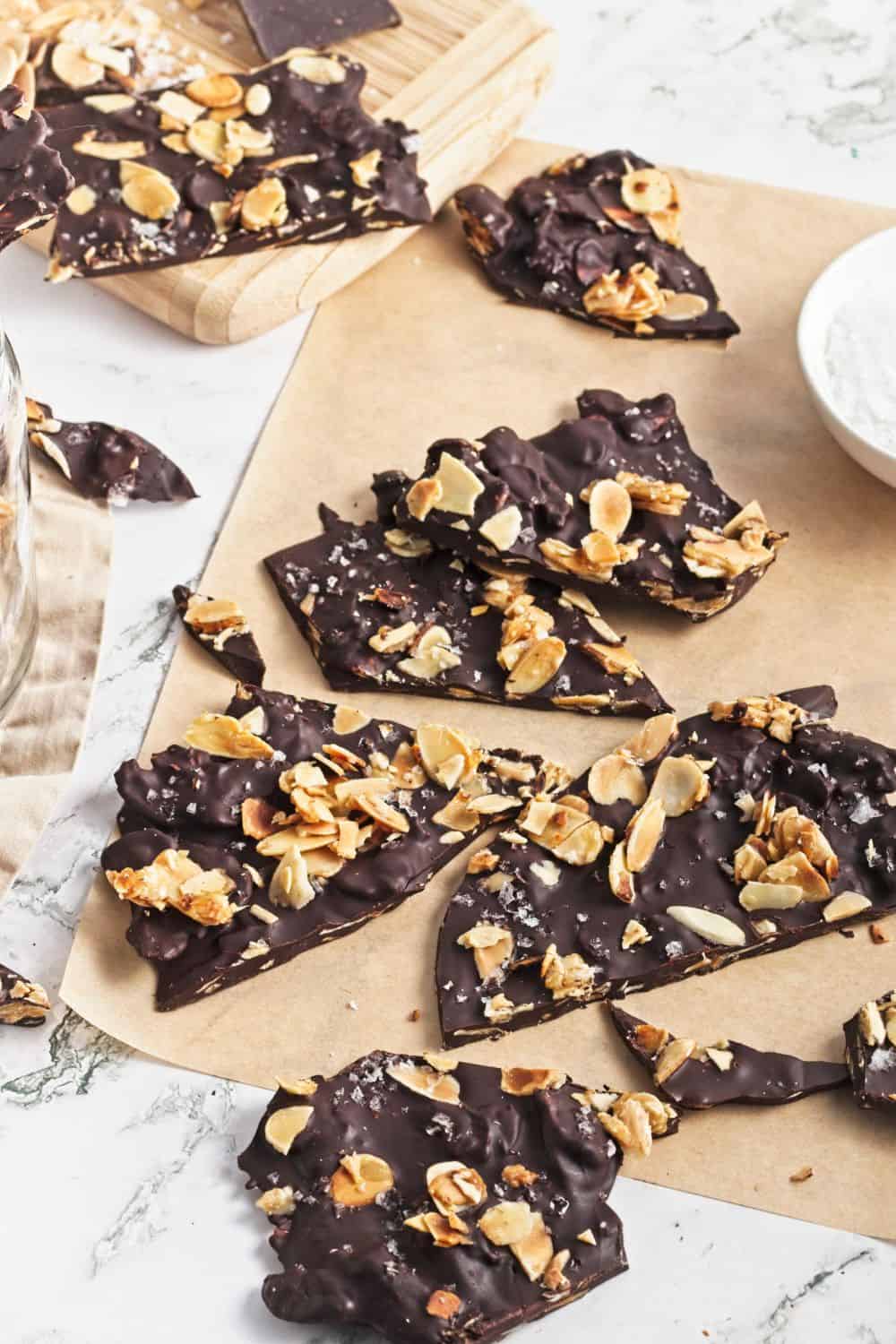 chocolate almond bark pieces on parchment paper.