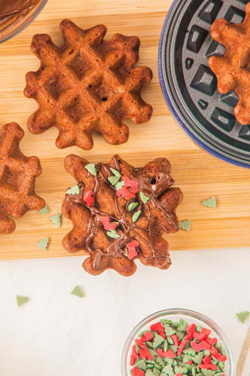 decorated waffle cookies on board.