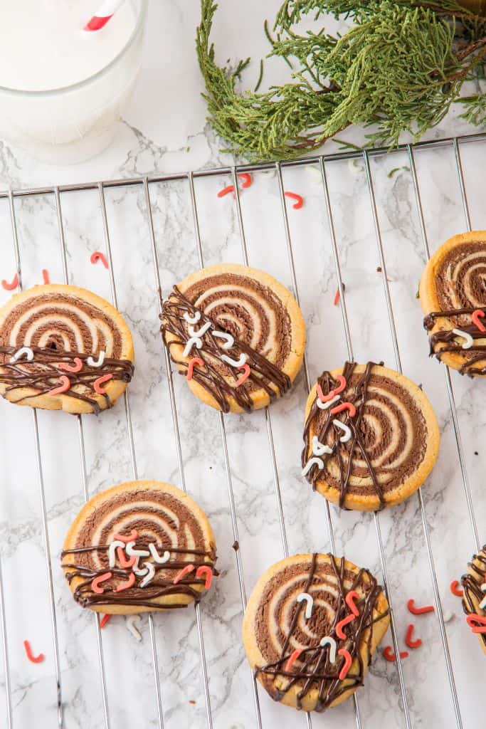 chocolate pinwheel cookies on wire rack.