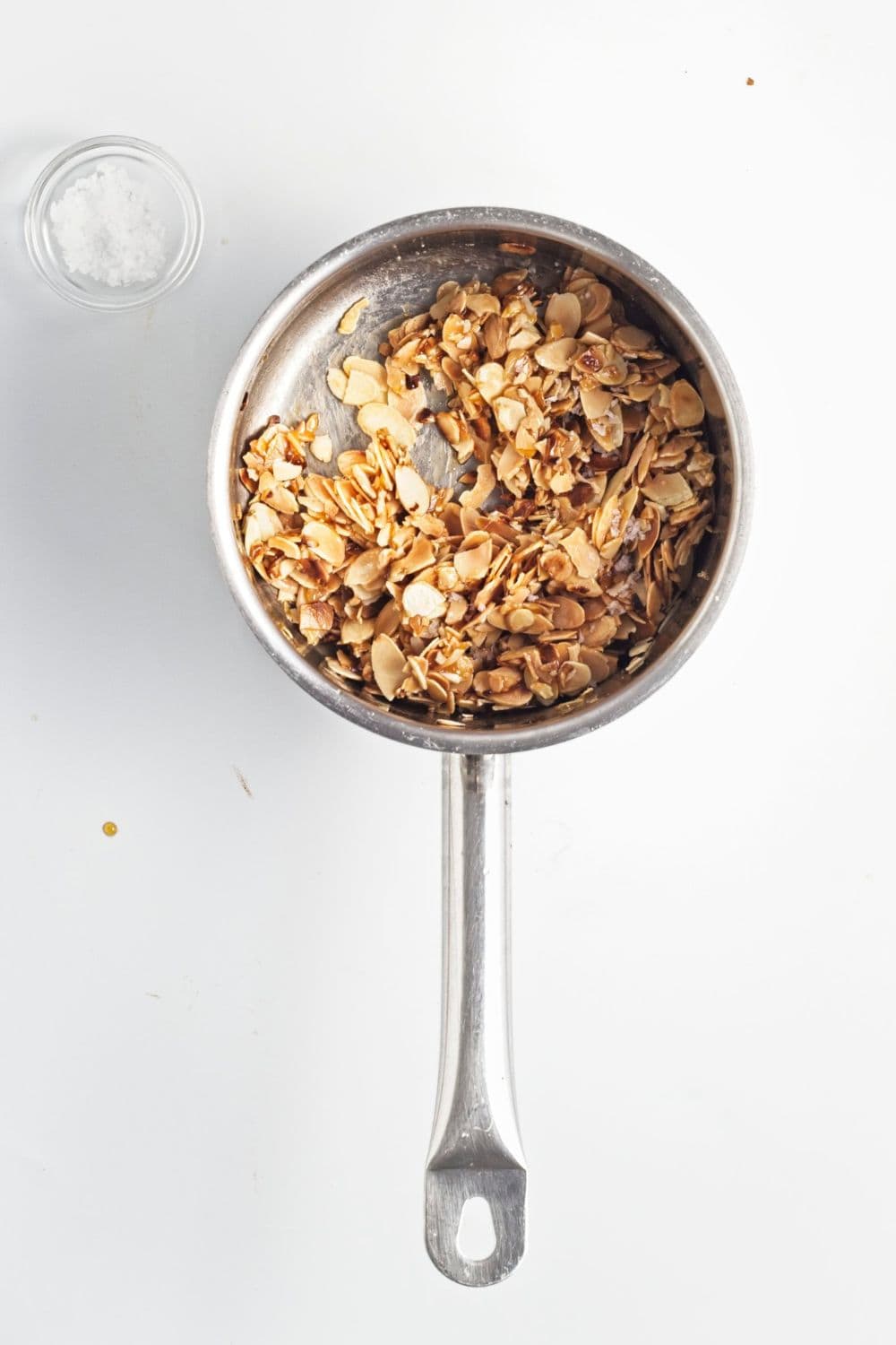 flaked almonds in saucepan.