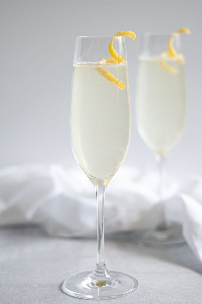 french 75 cocktail in champagne glass.
