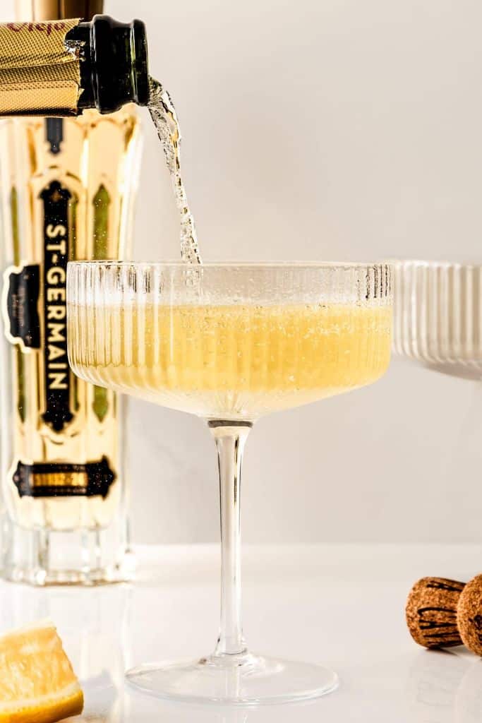french 77 champagne cocktail in couple glass.