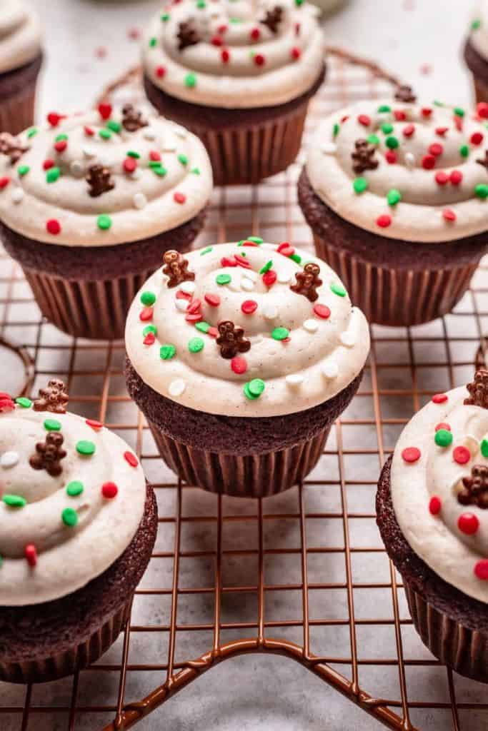 gingerbread cupcakes with festive sprinkles on frosting.