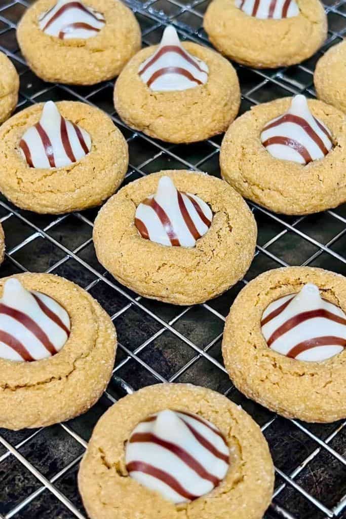 gingerbread blossom cookies on wire rack.