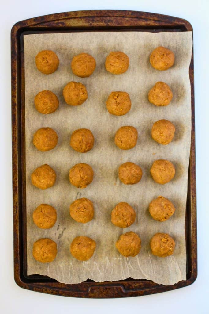 rolled gingerbread cake balls on tray.