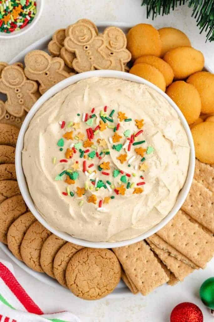 bowl with gingerbread dip and cookies on plate.