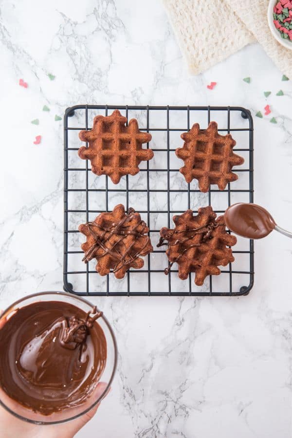 drizzling melted chocolate on cookies.
