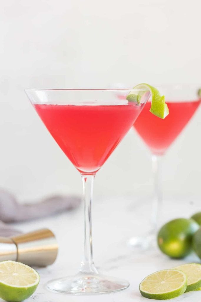 pink cosmopolitan cocktail with lime.