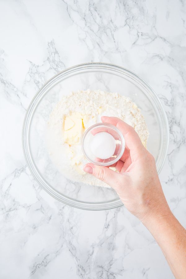 adding ingredients to bowl.